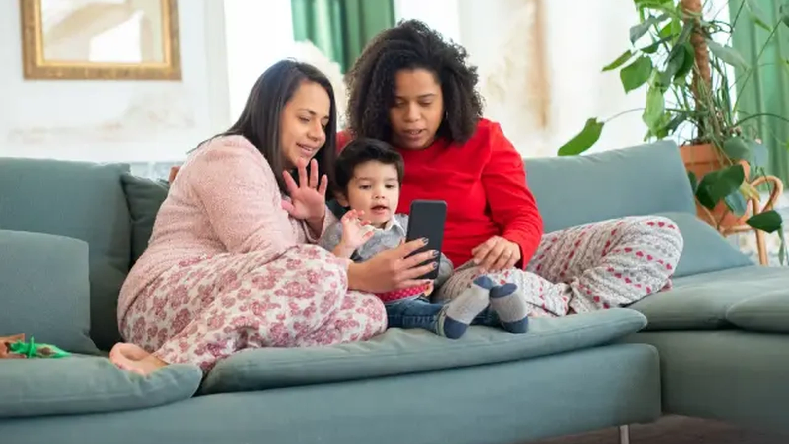 Family looking at a phone together
